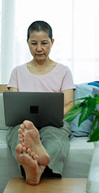 Woman looking at laptop