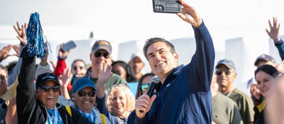 person taking group selfie