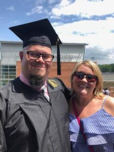 Melissa and husband Melissa with husband in graduation gown