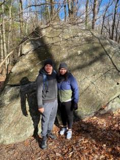 Myra and Kelvin in hiking gear in nature