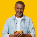 Man holding phone and smiling
