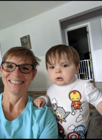 woman smiling with her baby grandson