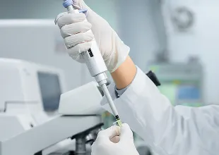 Technician using lab equipment