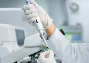 Technician using lab equipment