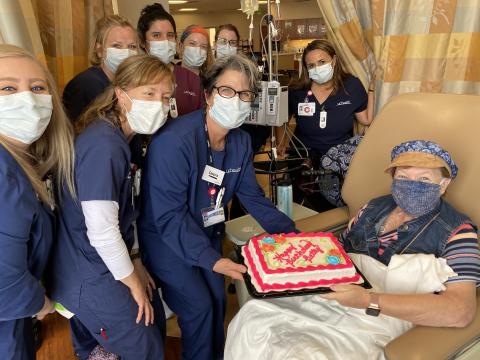 Betty at the hospital with her healthcare team for a surprise birthday party