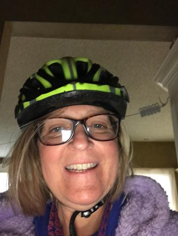 Michelle wearing a helmet at home smiling